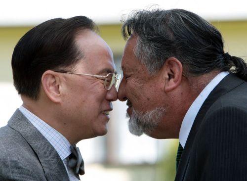 Dr Sharples greets Donald Tsang at Orakei marae, 10 April 2012.